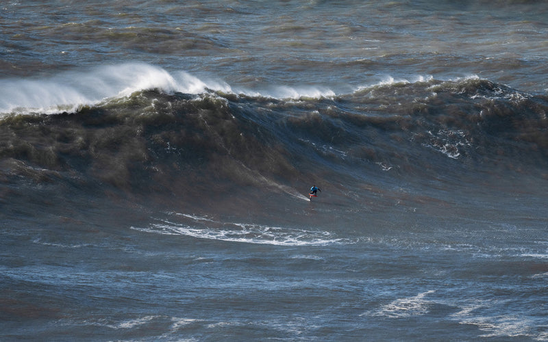 Waves for Life: Matt Davies foiling Nazaré