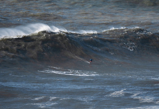 Waves for Life: Matt Davies foiling Nazaré