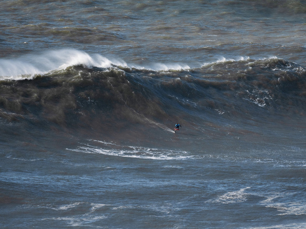 Waves for Life: Matt Davies foiling Nazaré